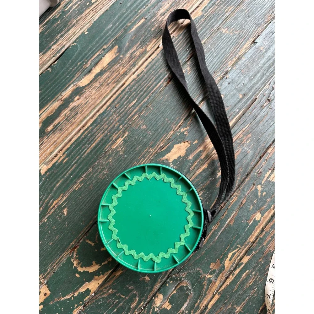Green Plastic Round Storage Canister with Carrying Strap and Screw Lid